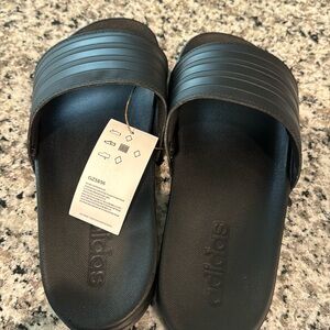 Adidas Slides. Black. Brand new. Size 8 men. Women’s size 9